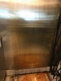 Side of the refirgrator with dirt