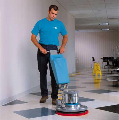 Man Buffing Tile Floor