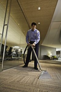 Man cleaning the carpet